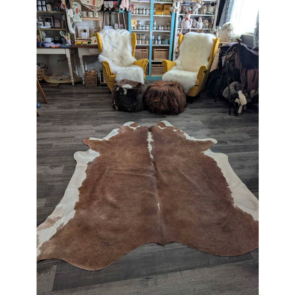 Brown and white large cowhide rug with natural fur texture showcasing beautiful rugs and unique characteristics