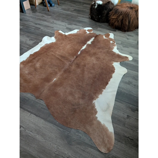 Large cowhide rug cow7 in brown and white with natural fur texture perfect for beautiful rugs with unique characteristics
