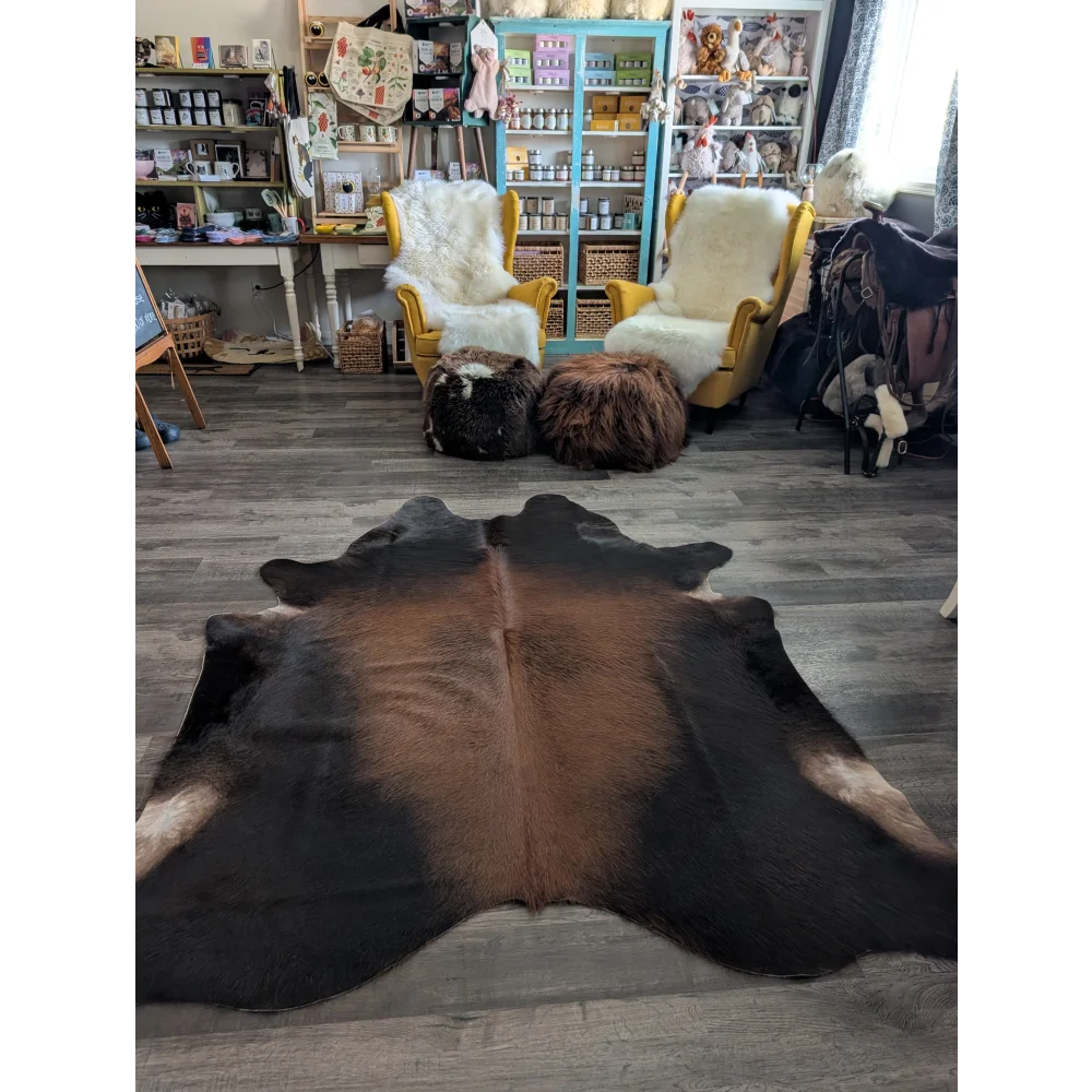 Large cowhide rug cow9 with beautiful brown and black natural fur texture and unique characteristics
