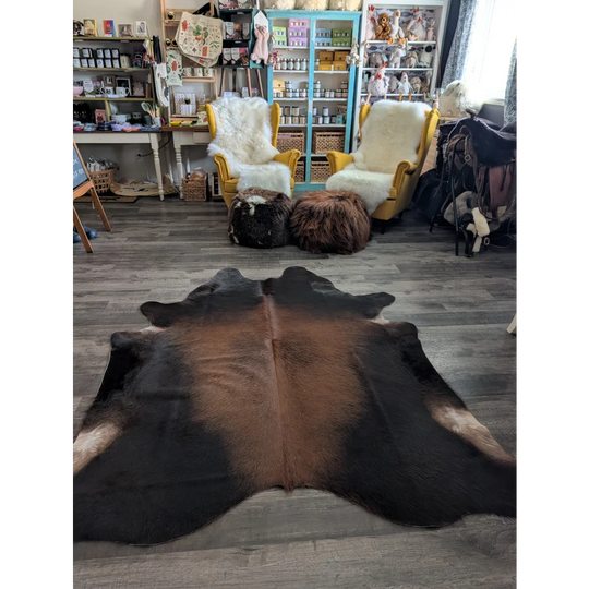 Large cowhide rug cow9 with beautiful brown and black natural fur texture and unique characteristics