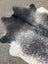 Extra large black and white speckled large cowhide rug with natural irregular edges and unique characteristics