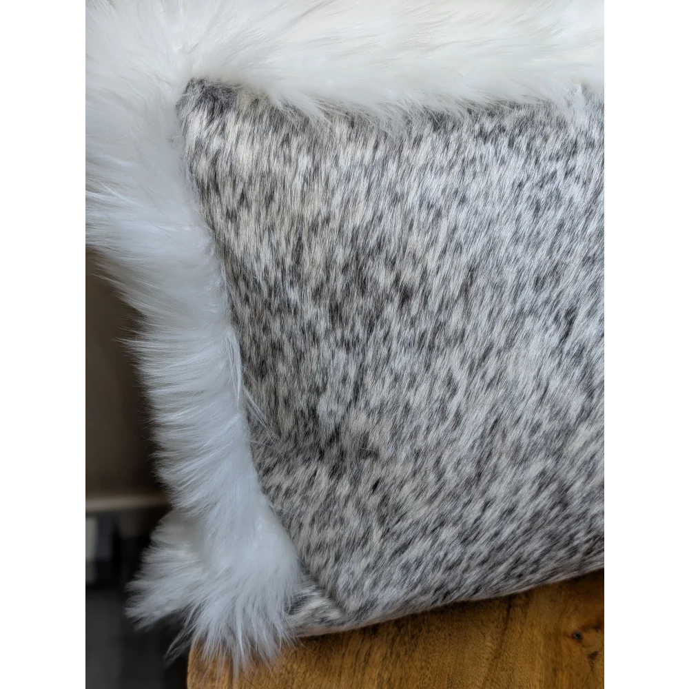 Gray and white speckled cowhide pillow with plush white merino sheepskin trim by angus oliver canada