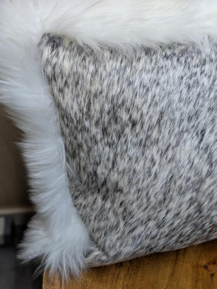 Gray and white speckled cowhide pillow with plush white merino sheepskin trim by angus oliver canada
