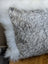Gray and white speckled cowhide pillow with plush white merino sheepskin trim by angus oliver canada