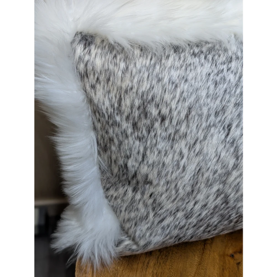 Gray and white speckled cowhide pillow with plush white merino sheepskin trim by angus oliver canada