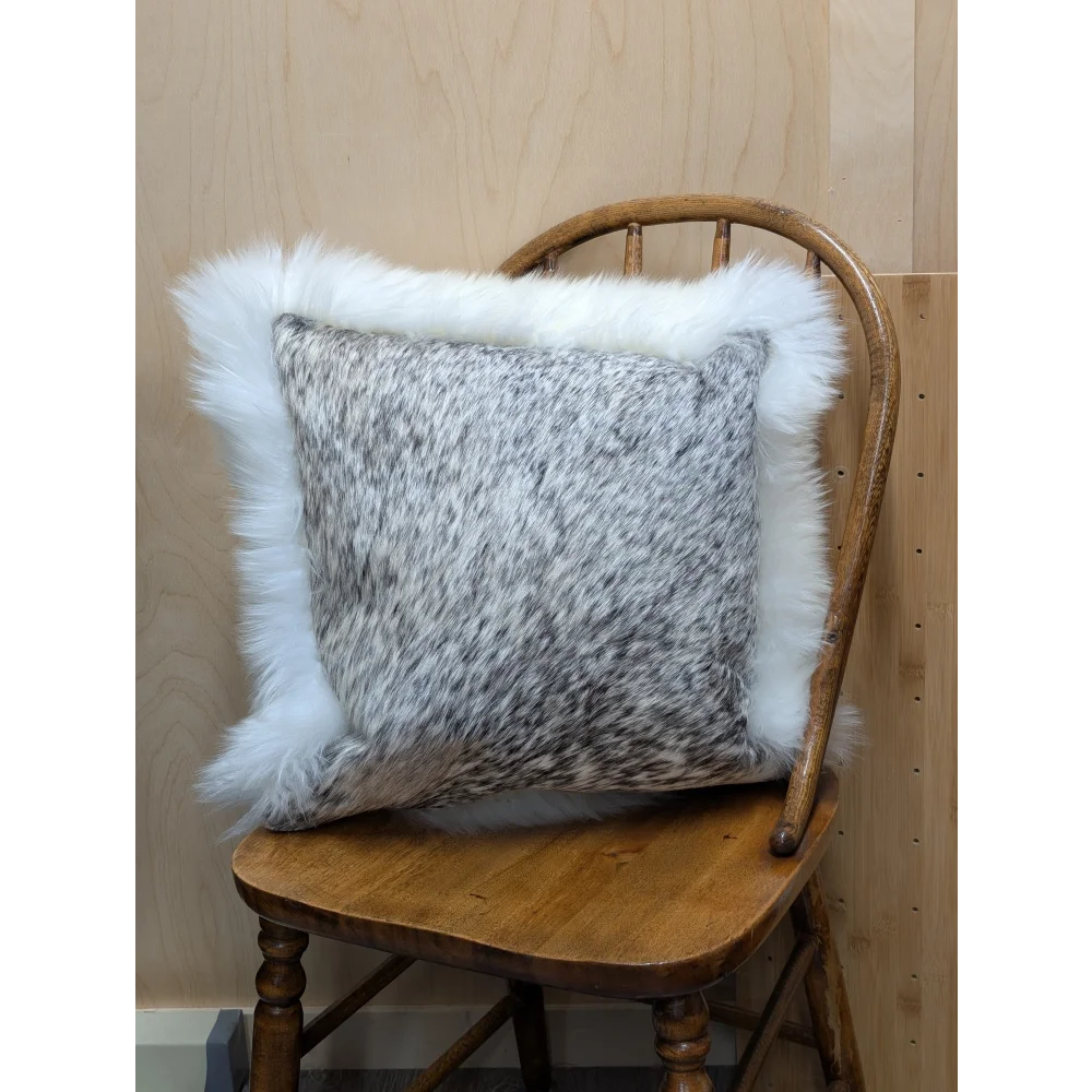 Gray and white speckled cowhide pillow with plush white merino sheepskin trim by angus oliver canada