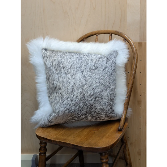 Gray and white speckled cowhide pillow with plush white merino sheepskin trim by angus oliver canada