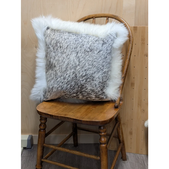 Gray and white speckled cowhide pillow with plush white merino sheepskin trim by angus oliver canada