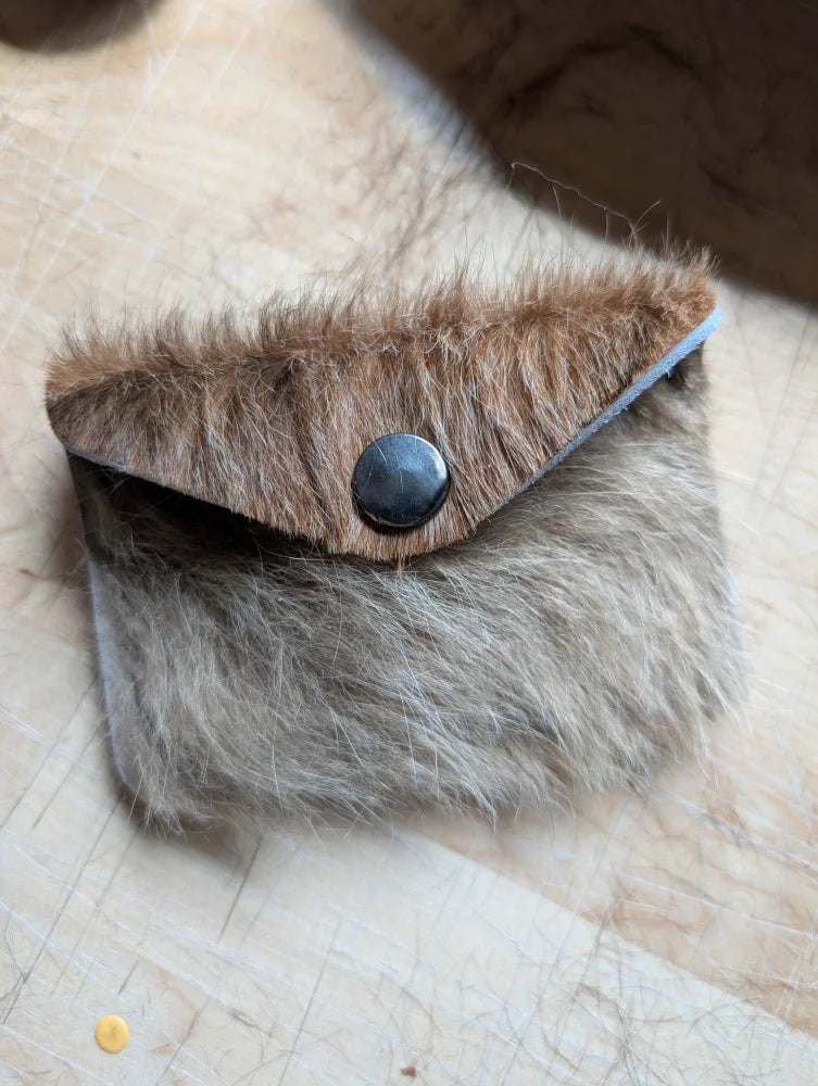 Furry brown and gray cowhide bank card holder with black button closure by angus oliver canada sheepskin rugs and cowhide rugs