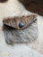 Furry brown and gray cowhide bank card holder with black button closure by angus oliver canada sheepskin rugs and cowhide rugs