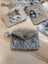 Gray and white cowhide keychain card holder pouch with stitched flap metal button closure and attached ring