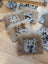 Faux fur cow face keychain card holders in natural and gray tones with stitched details for easy access