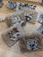 Faux fur cow-themed keychain card holders with gray and white marbled face design for stylish card storage