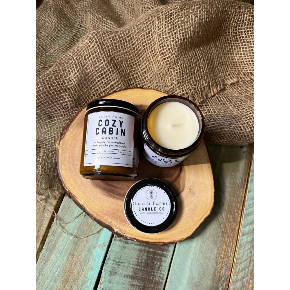 Cozy Cabin Candle in amber jar on rustic wooden tray