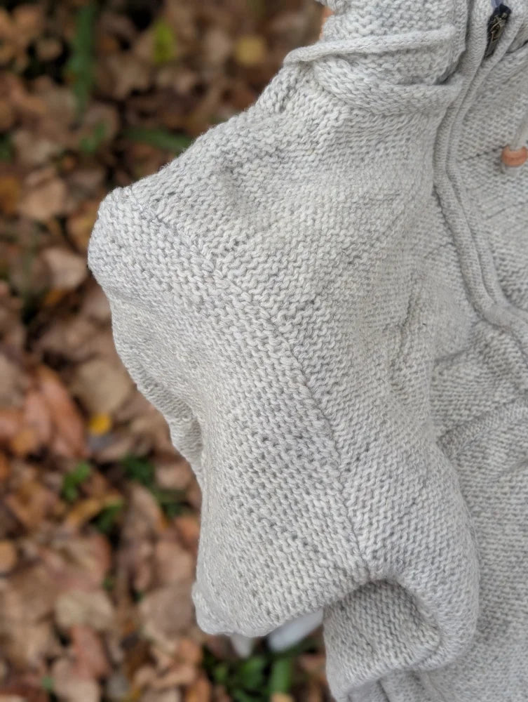 Cream woolen calgary cardigan soft fleece light gray knitted sweater with textured cable knit and ribbed cuffs made from zealand wool