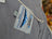 Gray fleece tag on cream woolen calgary cardigan shows soft fleece made with 100% new zealand wool and mountain logo