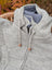 Cream woolen calgary cardigan in light gray knit with soft fleece blue lining and wooden toggle pulls made from zealand wool