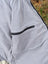 Light gray cream woolen calgary cardigan with soft fleece fabric and black zipper detail for cozy wear