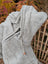 Cozy cream woolen calgary cardigan in light gray knitted with ribbed texture and wooden toggle drawstring, soft fleece lining