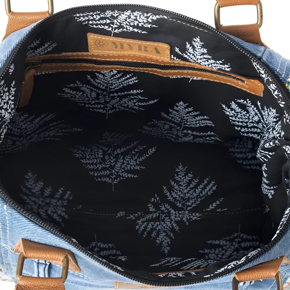 Crimson Glade tote in upcycled denim with black floral canvas interior