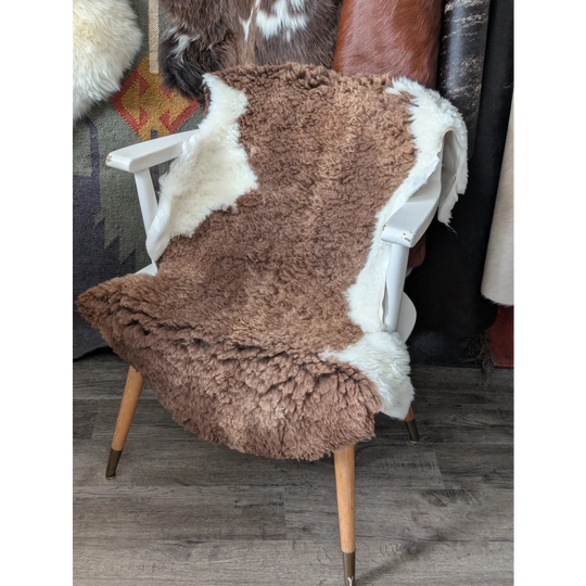 Fluffy cloud like Oeko Tex sheepskin rug on white chair