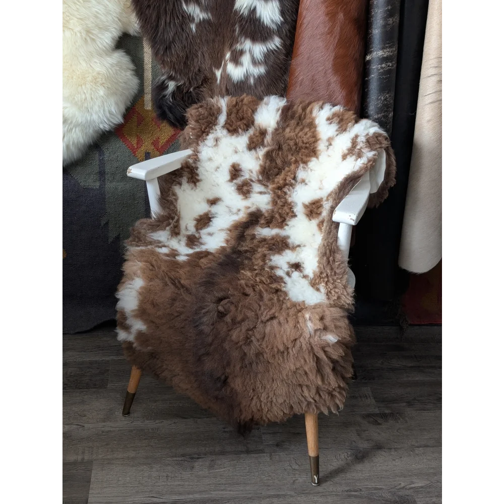 Cozy 42x26.5 fluffy cloud cowhide throw on white chair, oeko tex natural colours