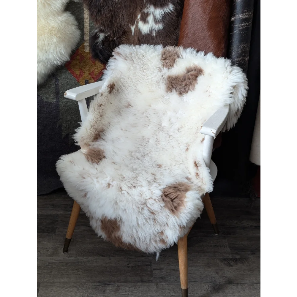 Fluffy cloud like oeko tex sheepskin rug on white chair