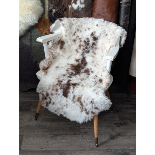 Fluffy cloud like oeko tex sheepskin rug on white chair