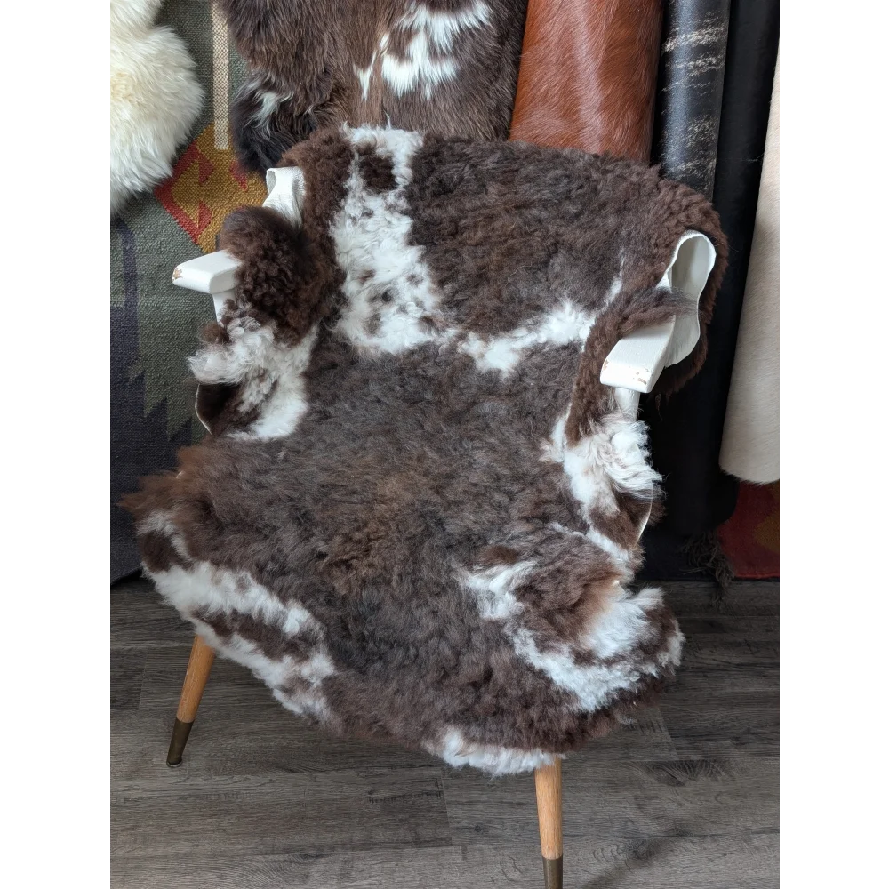 Fluffy cloud oeko tex sheepskin rug on modern armchair