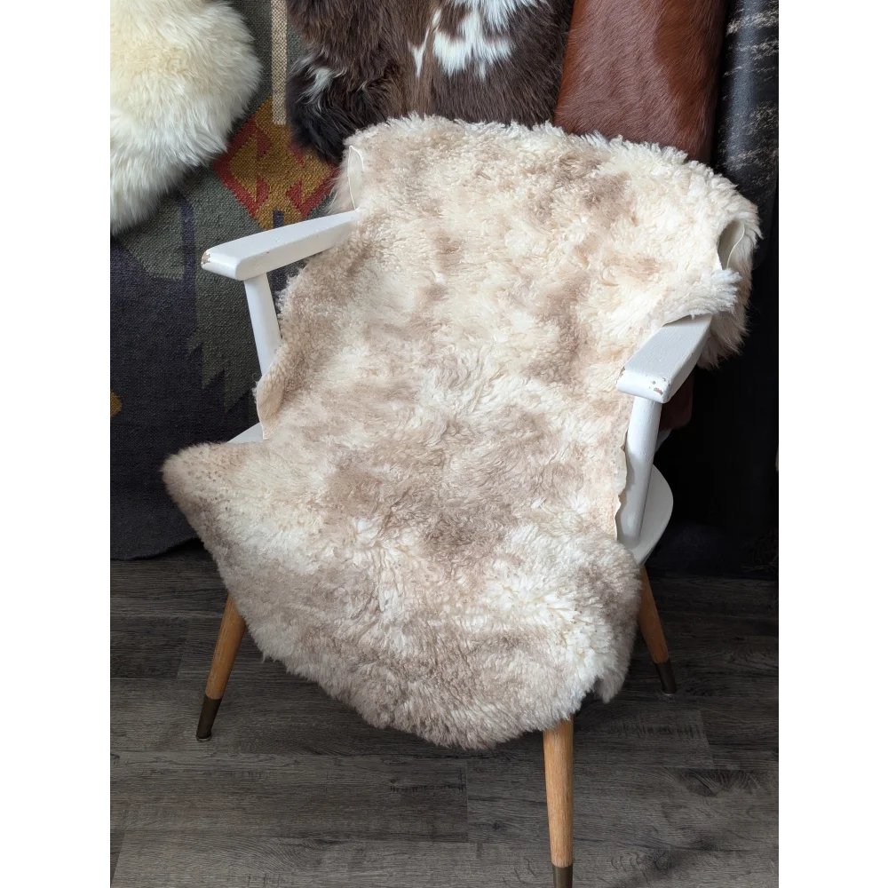 CSA4 oeko tex fluffy cloud rug in natural colours wool on white chair