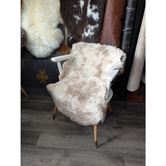 Cozy oeko tex fluffy cloud rug in natural colours wool on white chair