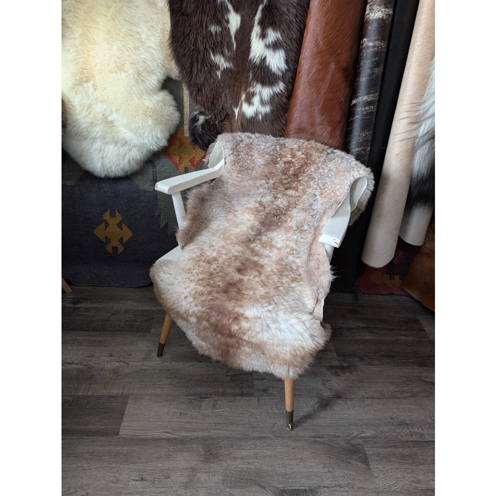 Fluffy cloud sheepskin rug, Oeko Tex, 41x26in on white chair