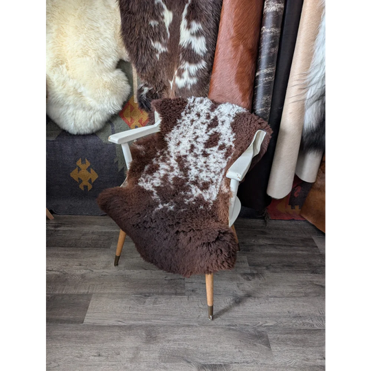 Fluffy cloud oeko tex sheepskin in natural colours on mid-century chair