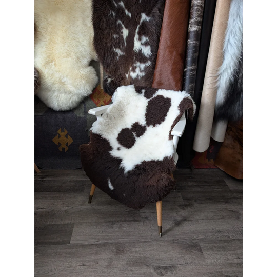 Cozy white chair with fluffy cloud Oeko-Tex sheepskin rug