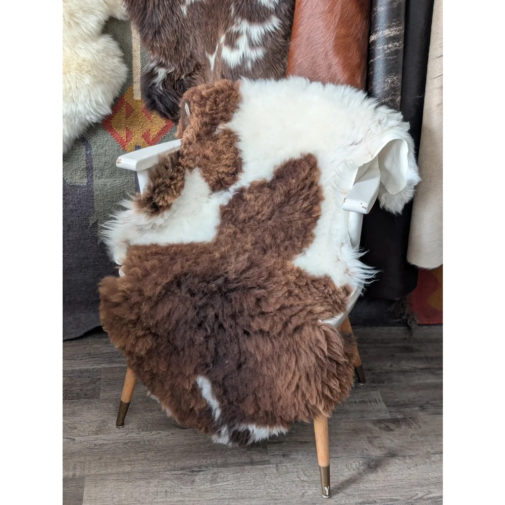 Fluffy cloud like Oeko Tex sheepskin rug on white chair