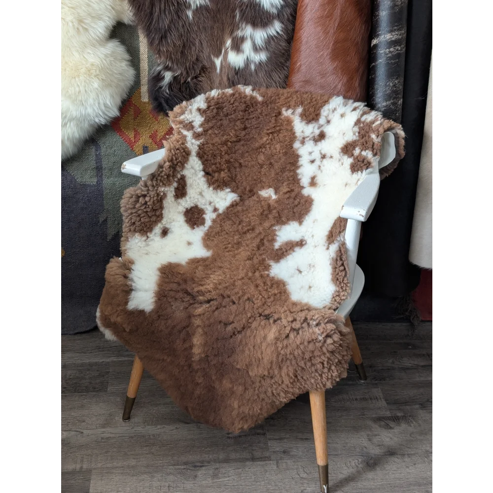 Fluffy cloud sheepskin rug CSB17 draped over white chair