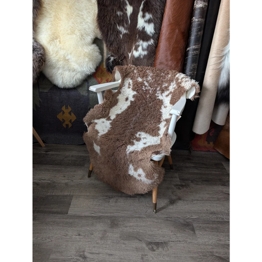 Fluffy cloud like Oeko Tex sheepskin rug on white chair