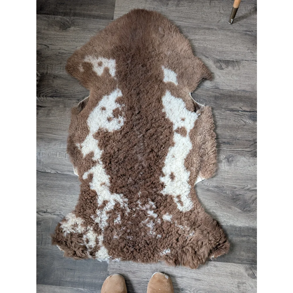 Fluffy cloud like Oeko Tex sheepskin rug in natural brown white 46.5x25.5