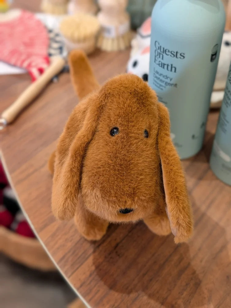 A soft tan fur dachshund toy with long floppy ears and black button eyes perfect for cuddling