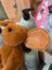 A plush tan dachshund toy with soft fur and suede textured inner ears perfect for cuddling