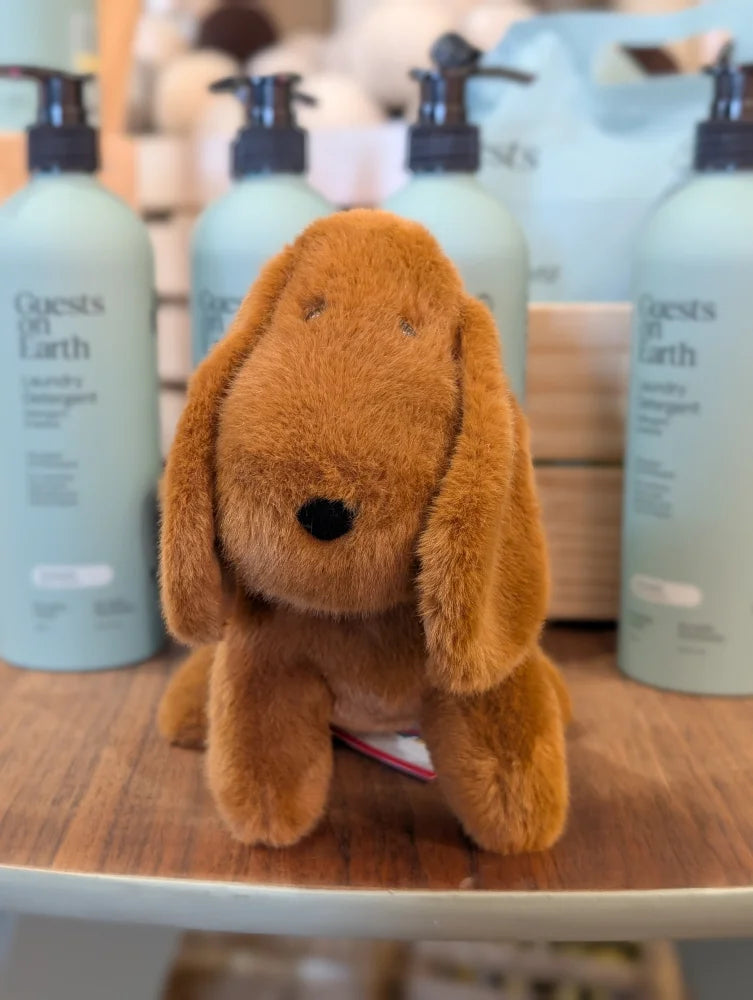 A plush tan dachshund toy with long floppy ears and a black nose perfect for cuddling or playtime