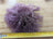 Dark pink sheepskin pom pom with lavender curly wool and ruler scale