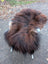 Fluffy dark rusty long wool natural icelandic sheepskin chair with white metal legs featuring natural black icelandic fur