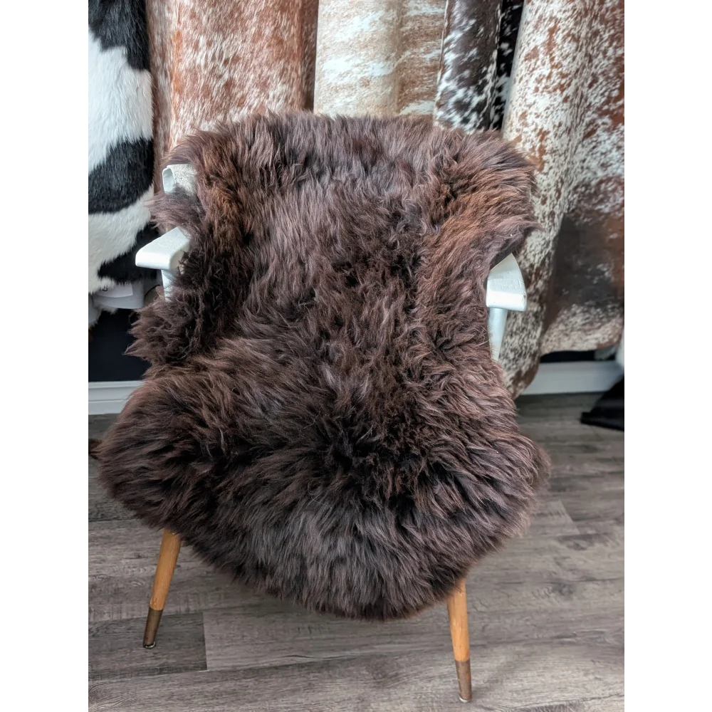 Gorgeous fluffy British sheepskin rug on white chair