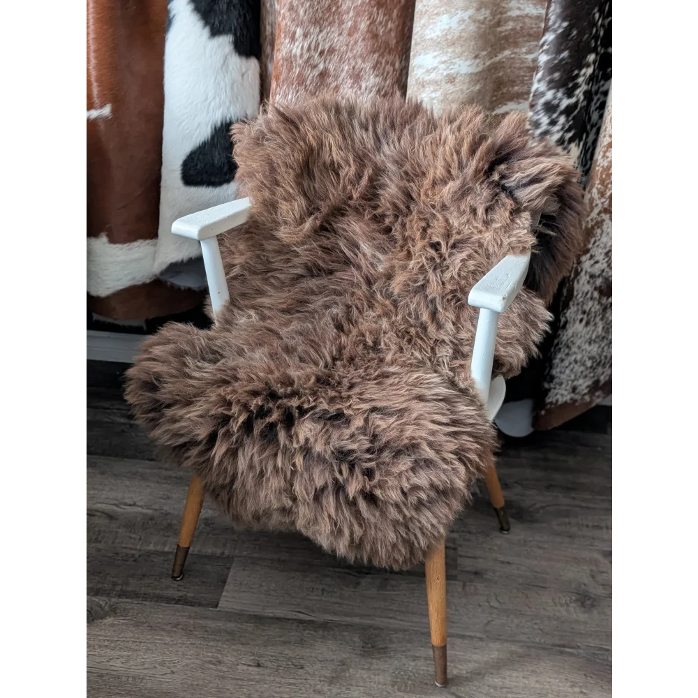 Cozy fluffy British sheepskin throw on white chair, 45x27 inches