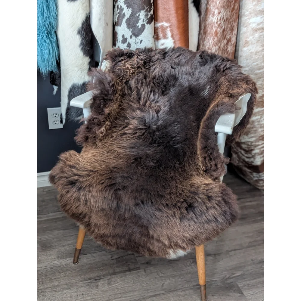 Gorgeous fluffy 44x33 rare British sheepskin rug on white chair