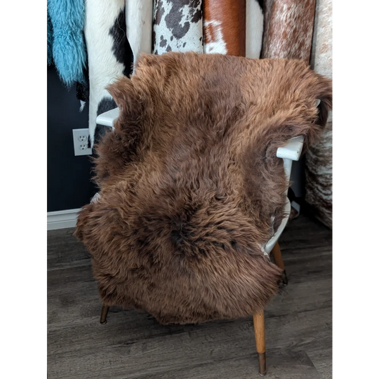 Gorgeous fluffy 46’’ x 31’’ rare British sheepskin rug on white chair