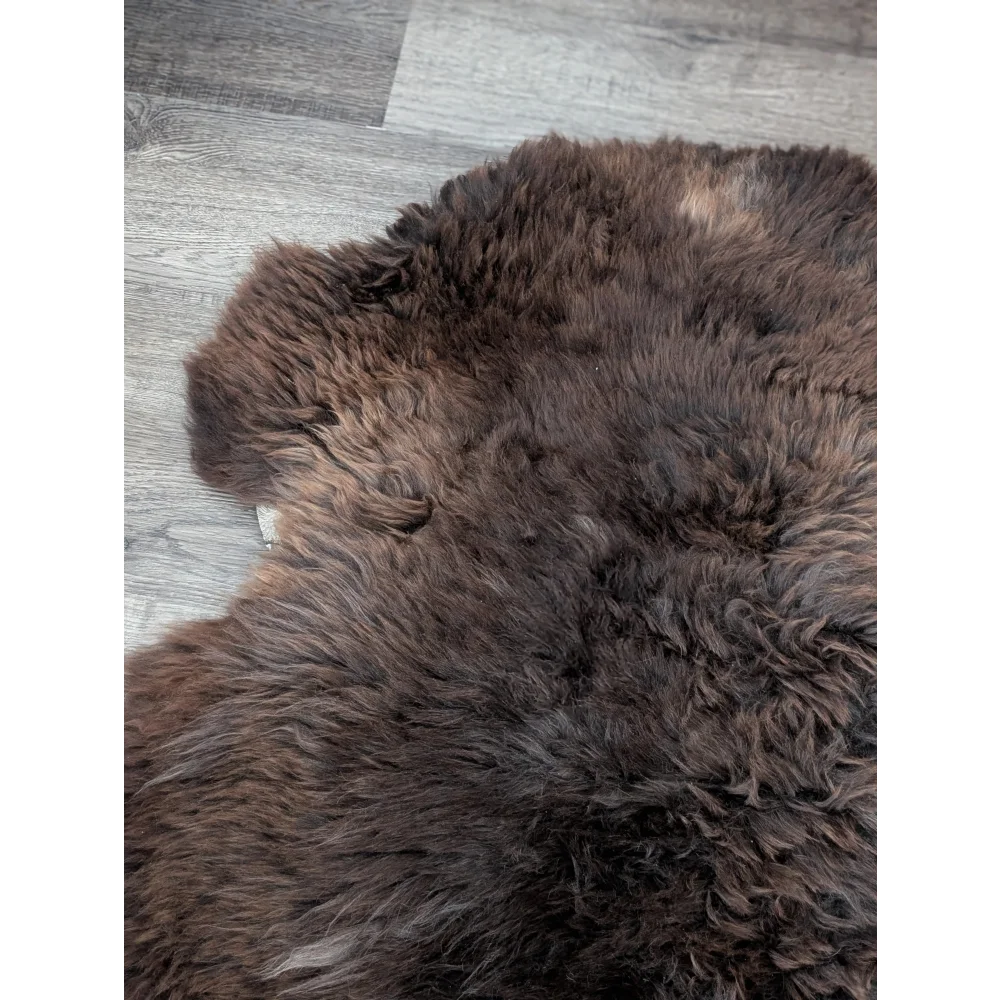 Gorgeous fluffy 45’’ x 30’’ rare British sheepskin rug on gray wood floor