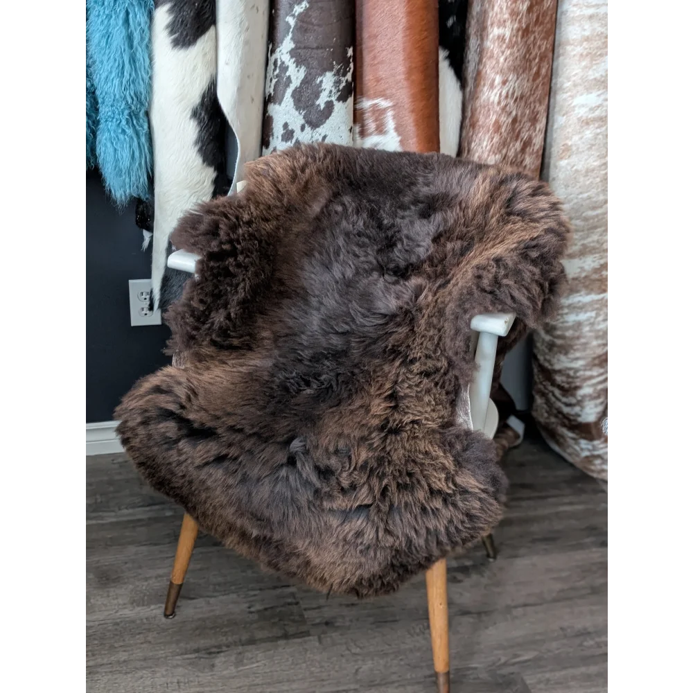 Gorgeous fluffy 44x32 rare British sheepskin rug on white chair