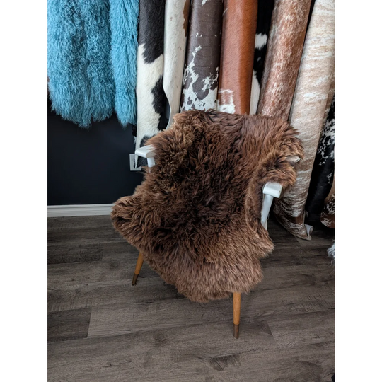 Gorgeous fluffy 48x32 rare British sheepskin rug on white chair